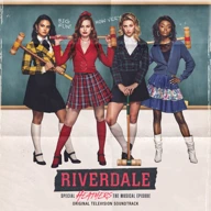 An album cover, with four extremely photogenic women posing as high school students in front of a green blackboard wearing fashionably tailored jackets and skirts, they hold croquet mallets.